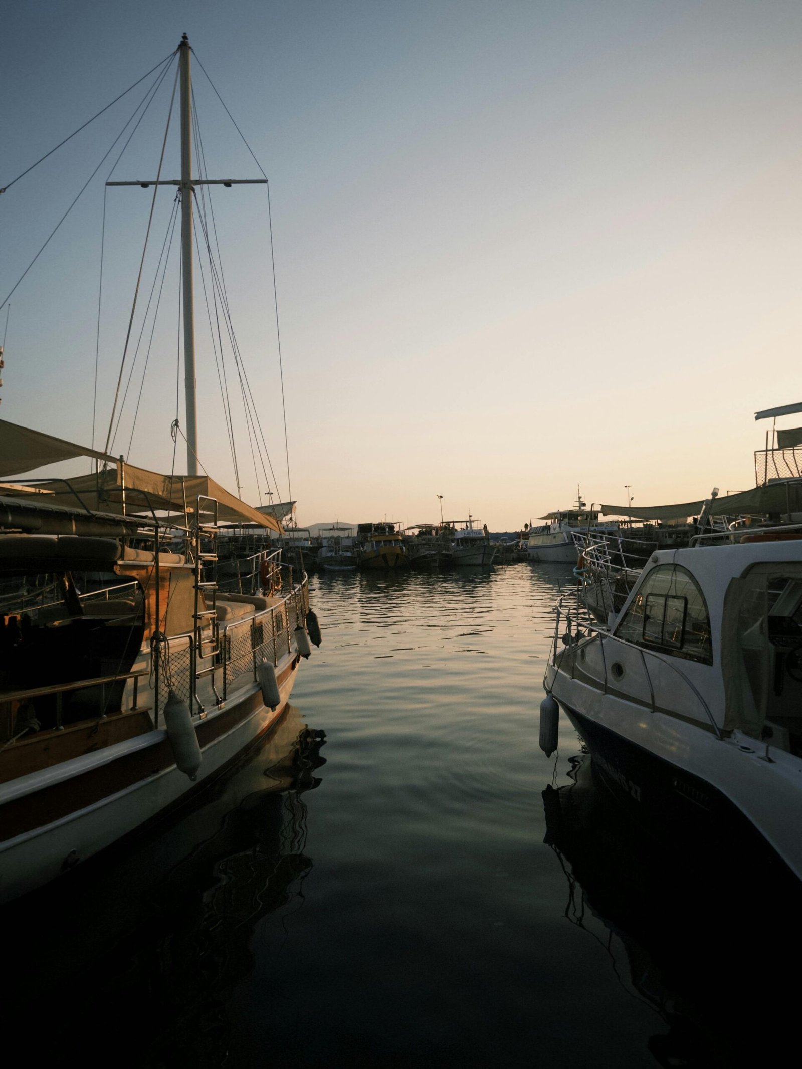 Tranquil Sunset View of Boats in a Harbor